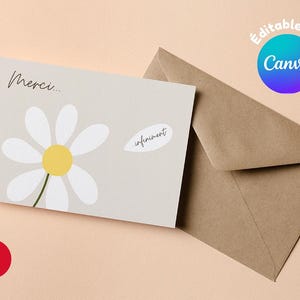 Peut inclure: Une carte blanche avec une marguerite blanche et le texte "Merci... infiniment" sur un fond gris clair. La carte est à côté d'une enveloppe brune.