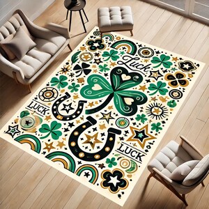May include: A white area rug with a green shamrock design. The rug is covered in gold stars, horseshoes, and the word "Luck" repeated twice.