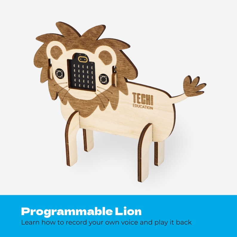 May include: A laser-cut wooden lion figure featuring a dark brown mane and a light tan body. The lion has a square electronic micro-controller board embedded in its face with a grid of lights and two circular buttons. The text TECHI EDUCATION is engraved on the side.