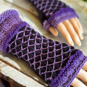 May include: A pair of purple and black fingerless gloves with a diamond pattern. The gloves are knitted and have a textured look.