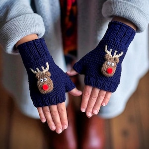 May include: Navy blue fingerless gloves with a knitted reindeer design. The reindeer has a brown head, white antlers, a red nose, and black eyes. These gloves are a festive accessory for the winter season.