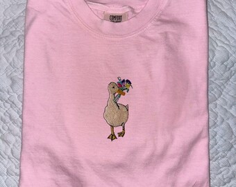 Camiseta con bordado floral de ganso – con bolsillo o en el pecho