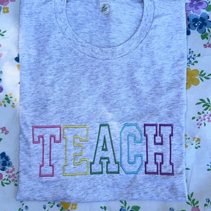Teach Embroidered T-Shirt