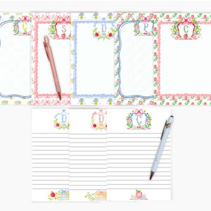 May include: A stationery set with personalised letterheads and lined notepaper. The letterheads have decorative borders with floral and bow accents. A pink and a silver pen are included. The stationery is in pink, blue, and white.