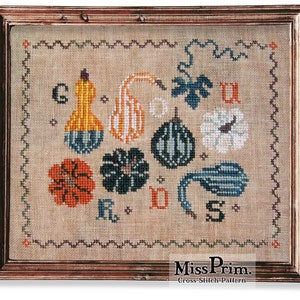 May include: Cross-stitch pattern featuring a variety of gourds and pumpkins in shades of orange, yellow, green, and blue. The pattern includes the letters "GOURDS" in a stylized font.