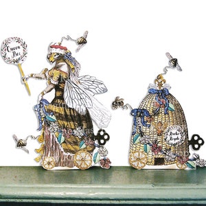 May include: A whimsical illustration featuring a queen bee character in a yellow and black dress, holding a sign reading "Queen Bee". A decorative beehive with the words "Ruche Royale" is also shown. The image has a vintage style.