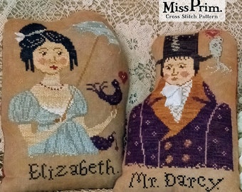 May include: Two beige cross-stitch pillows featuring characters from a classic novel. One pillow depicts a woman in a blue dress with the name "Elizabeth." The other pillow shows a man in a purple coat with the name "Mr. Darcy."