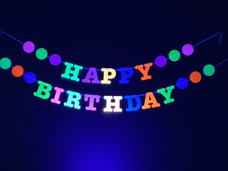 May include: A neon green, yellow, pink, blue, and orange "Happy Birthday" banner with colorful circle decorations.