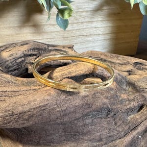 Vintage signed Monet gold etched bangle