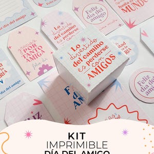 May include: A collection of printed paper gift tags and a small square box featuring grid patterns, pink and blue star icons, and Spanish text including phrases like Feliz día del amigo, Amiga, and Lo divertido del camino es perderse con AMIGOS.