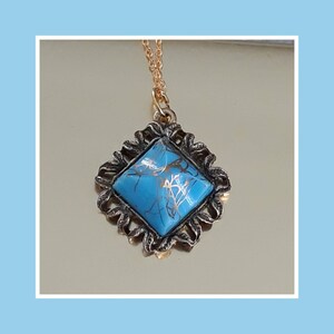A Blue Moon Over the Golden Islands. Teal and Gold Drizzle Charm Necklace with a Goldplated Chain- Mid Century Living