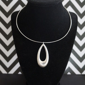 Red Hot Mod 1980's Does Swingin 1960's Large Lightweight Silver Teardrop Cutout Medallion Necklace image 1