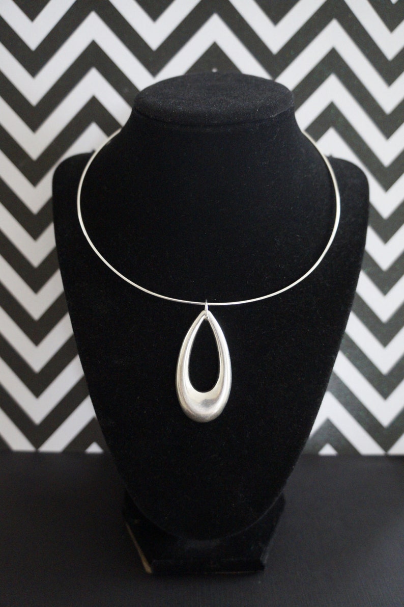 Red Hot Mod 1980's Does Swingin 1960's Large Lightweight Silver Teardrop Cutout Medallion Necklace image 1