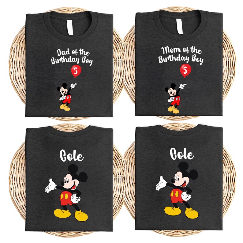 four black t-shirts with Mickey Mouse printed on them, each with a different name and age printed on the front.