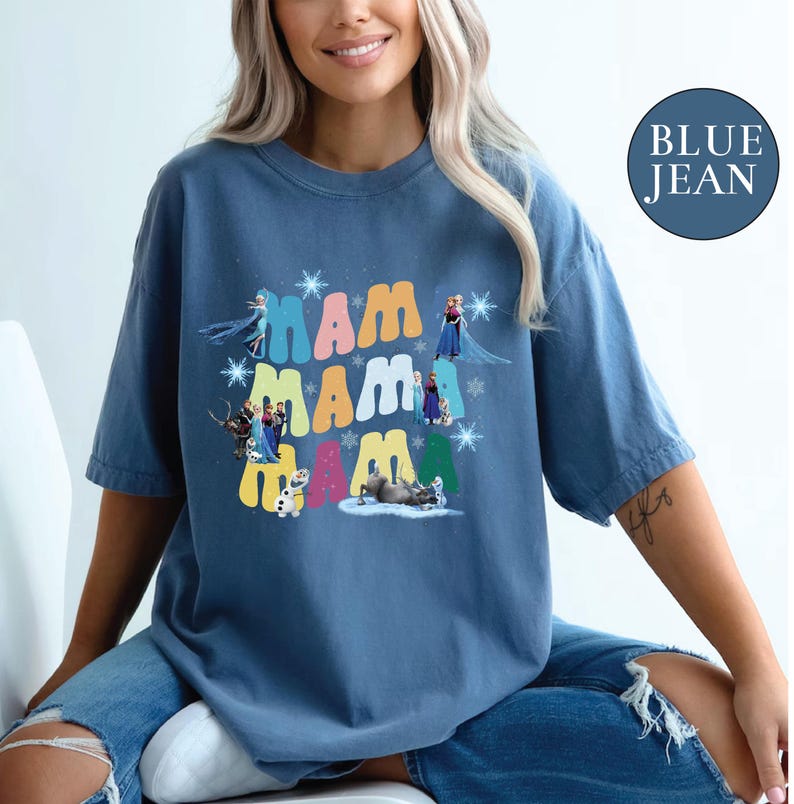 a woman sitting on a chair wearing a blue jean shirt