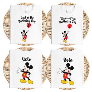 The image is a collage of four white t-shirts, each featuring a Mickey Mouse design and the name "Gole" printed on it. The t-shirts are arranged in a grid-like pattern, with the first row containing two shirts, the second row containing two shirts, and the third row containing two shirts.