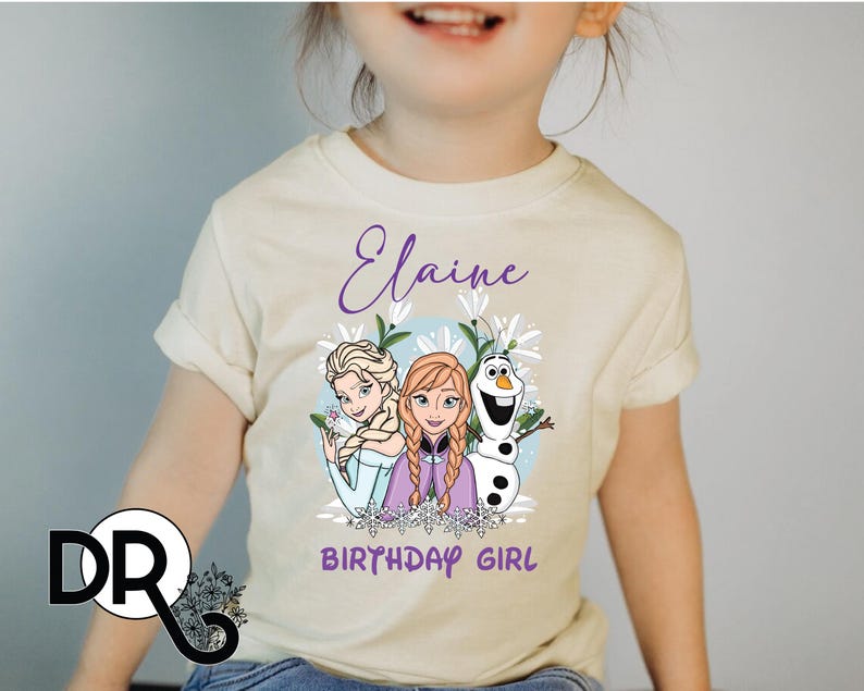 a little girl wearing a frozen princess shirt
