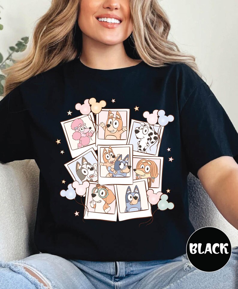 A woman wearing a black t-shirt with a collage of cartoon animal characters and various Disney-themed elements.
