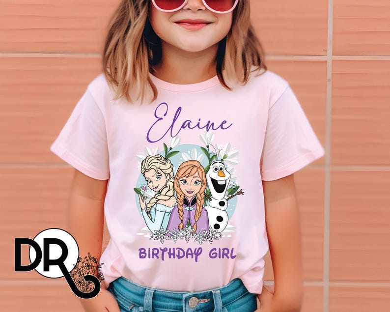 a little girl wearing a frozen princess shirt