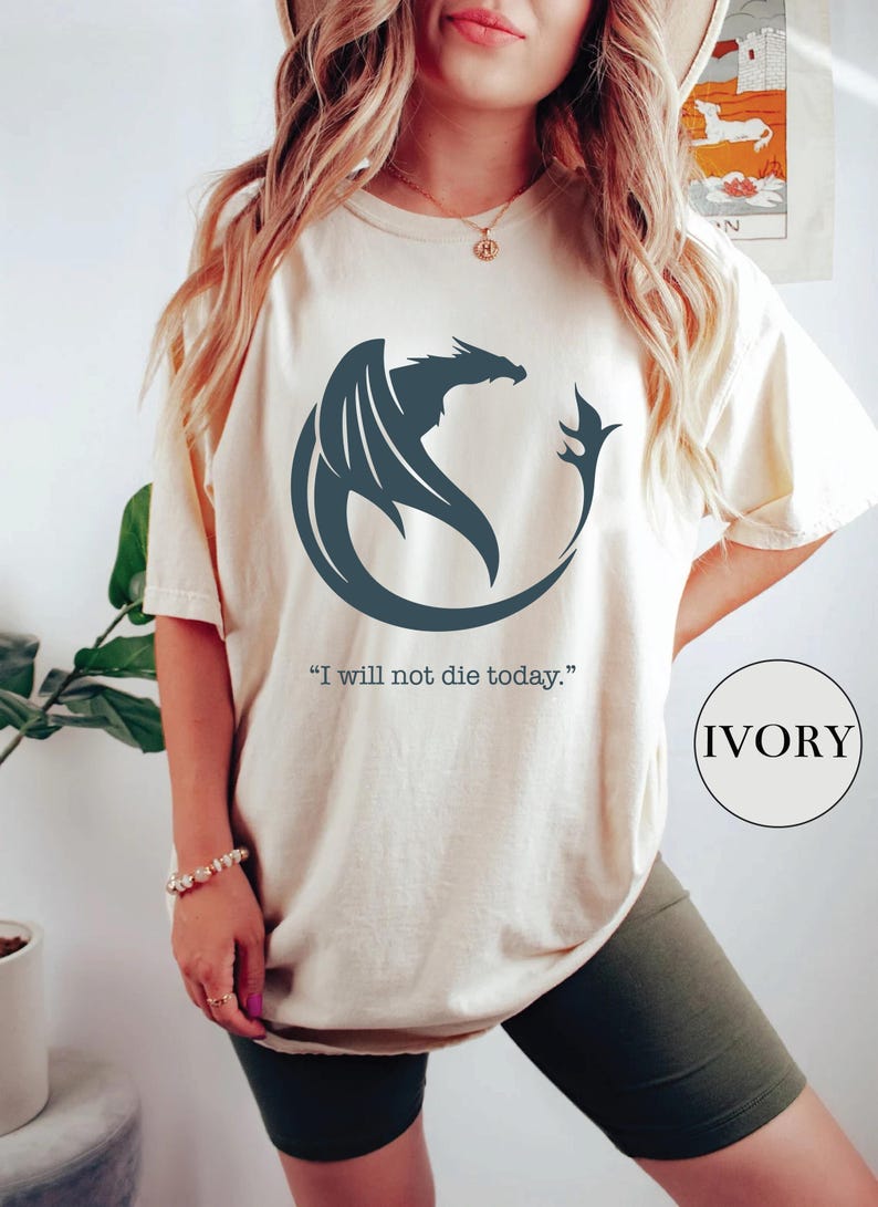 a woman wearing a t - shirt with a dragon on it