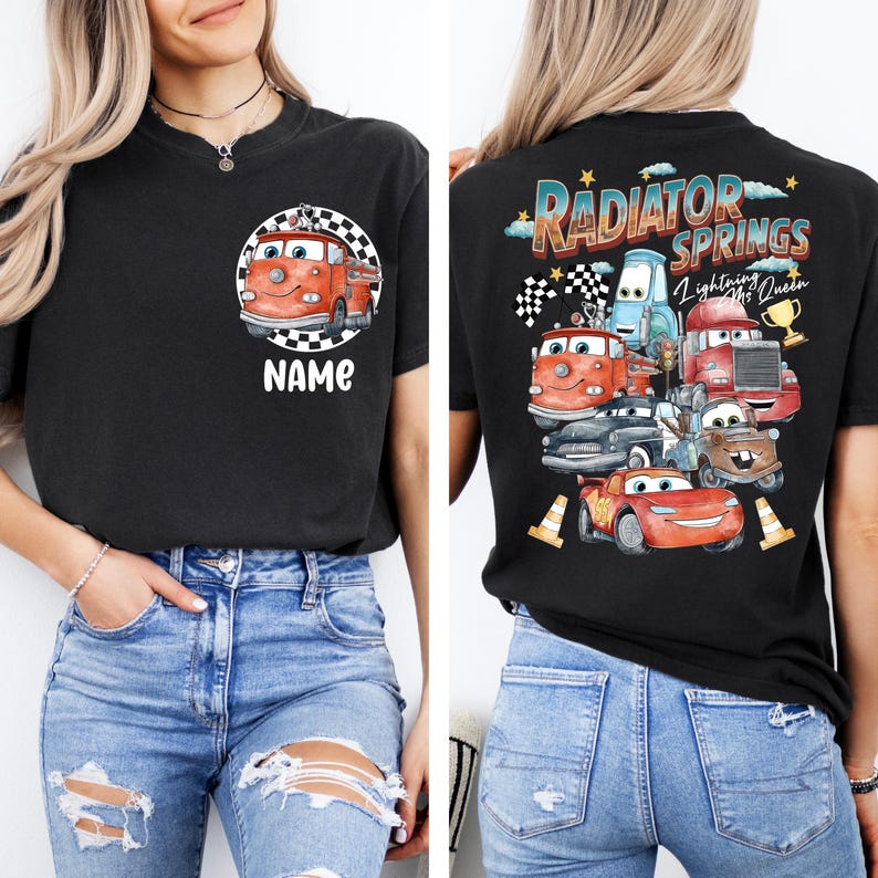 May include: Black t-shirt featuring a cartoon fire truck design inside a checkered circle, with the word "NAME" below. The back of the shirt displays a "Radiator Springs" graphic with various car characters and the text "Lightning McQueen".