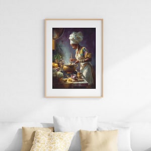 May include: A framed print of a woman cooking in a kitchen. She wears a white head wrap, apron, and colorful top. A pot simmers on the stove, with vegetables and fruit on the counter. The artwork has a warm, inviting color palette.