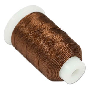 May include: A spool of brown thread with a white plastic core. The thread is tightly wound and has a slight sheen. Suitable for sewing, embroidery, or other craft projects.