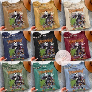 May include: Nine t-shirts in various colors, each featuring a Halloween-themed graphic. The design includes Jack Skellington, Sally, and other characters from "The Nightmare Before Christmas." The text "This is Halloween" is prominently displayed.