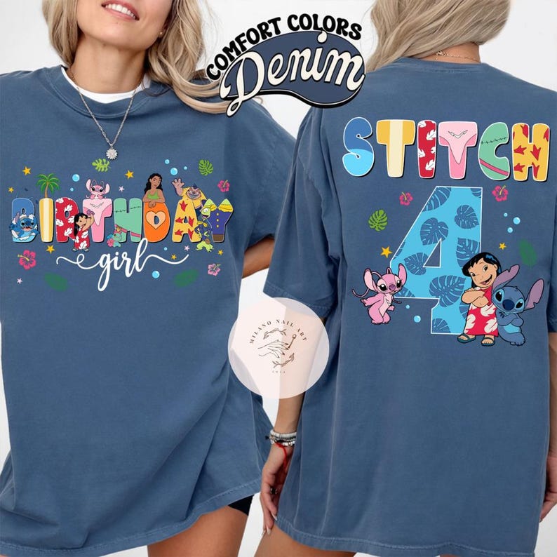 May include: Denim blue t-shirt with a colorful graphic featuring characters and text. The front of the shirt says "Birthday girl" with character illustrations. The back says "Stitch 4" with character illustrations. The shirt has short sleeves and a crew neck.