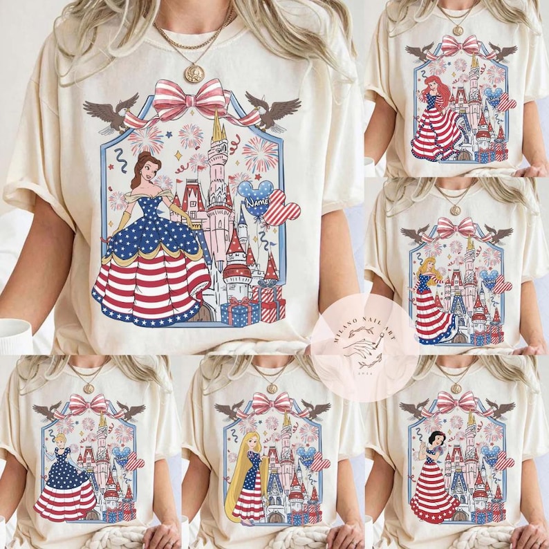May include: Cream-coloured t-shirts with a patriotic design featuring a princess in a red, white, and blue dress, a castle, fireworks, and a bow. The design includes eagles and heart-shaped balloons. The shirts are available in multiple designs.