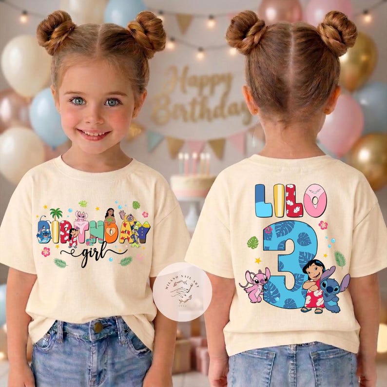 May include: A cream-colored t-shirt with a colorful "Birthday girl" design on the front and "Lilo 3" on the back. The front design includes cartoon characters and the text "Birthday girl". The back features the name "Lilo" and the number "3".