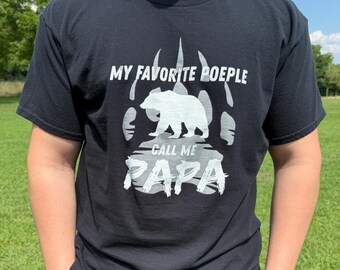 May include: Black t-shirt with the text "MY FAVORITE POEPLE CALL ME PAPA" in white. The design includes a bear silhouette and a bear paw print.