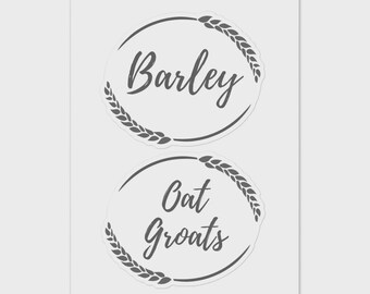 May include: Two round stickers with the words "Barley" and "Oat Groats" in a handwritten font. Each sticker has a wheat stalk design around the edge. The stickers are on a white background.