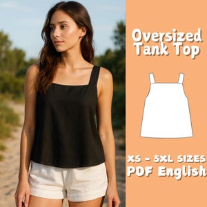 May include: A black oversized tank top with a square neckline and wide straps. The image also includes a white line drawing of the tank top and the text "Oversized Tank Top" and "XS - 5XL SIZES PDF English". The model is wearing white shorts.