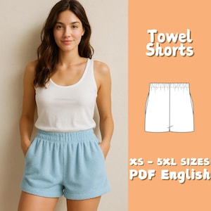 May include: A woman in a white vest top and light blue towel shorts. The image includes a diagram of the shorts and the text "Towel Shorts", "XS - 5XL SIZES", and "PDF English".