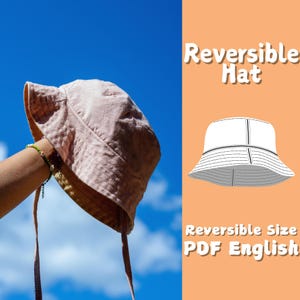 Könnte beinhalten: Ein umkehrbares Hut-Nähmuster im PDF-Format. Das Muster enthält Anweisungen in Englisch. Das Bild zeigt einen rosafarbenen Bucket-Hut.