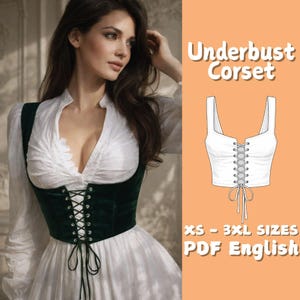 May include: An underbust corset in dark green velvet with a lace-up front, worn over a white blouse and dress. The image also includes a line drawing of the corset, with the text "Underbust Corset" and "XS - 3XL SIZES PDF English".