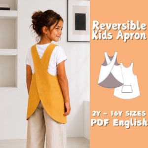 May include: A mustard yellow reversible kids apron with a cross-back design worn over a white t-shirt and light-colored pants. The graphic shows the apron pattern in white and gray with a pocket. Text reads: Reversible Kids Apron 2Y - 16Y SIZES PDF English.