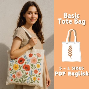 Puede incluir: Un bolso tote beige con un diseño floral con amapolas rojas, flores rosas y amarillas y detalles azules. Una persona sostiene la bolsa. El texto a la derecha dice "Basic Tote Bag" y "S-L Sizes PDF English".