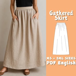 May include: A beige gathered skirt with pockets. The skirt is long and flowing, made of a light-coloured fabric. The image also includes a diagram of the skirt and the text "Gathered Skirt" and "XS - 5XL SIZES PDF English".