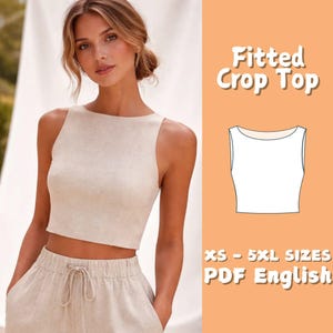 May include: A beige fitted crop top with a square neckline and matching high-waisted trousers. The image includes the text "Fitted Crop Top" and "XS - 5XL SIZES PDF English". The top is sleeveless and appears to be made of linen or a similar fabric.