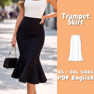 May include: A black trumpet skirt with a flared hem, paired with a white top. The skirt is shown on a person, and the image includes the text "Trumpet Skirt" and "XS - 5XL SIZES PDF English".