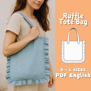 May include: A light blue tote bag with a ruffle trim. The bag has a rectangular shape with a matching blue handle. The text "Ruffle Tote Bag" is displayed in white, along with "S-L SIZES PDF English".