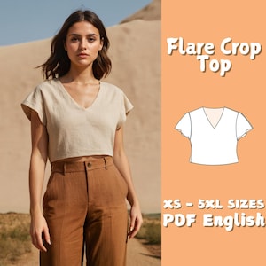 May include: A woman wearing a beige linen flare crop top with a V-neck and short sleeves, paired with brown high-waisted pants. The image includes the text "Flare Crop Top" and "XS - 5XL SIZES PDF English".