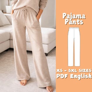 May include: Beige pajama trousers with a drawstring waist and wide legs. The trousers are part of a matching set. The image includes the text "Pajama Pants" and "XS - 5XL SIZES PDF English".