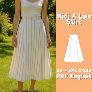 以下が含まれることがあります： 白地にベージュのストライプが入ったミディAラインスカート。白いタンクトップを着た人がスカートを着用しています。画像にはスカートの図と「XS - 5XL SIZES PDF English」というテキストが含まれています。