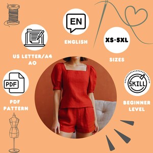 以下が含まれることがあります： 赤いリネンのトップスとショートパンツのセット。スクエアネックとパフスリーブが特徴です。画像には、パターンがXS-5XLサイズで利用可能で、初心者レベルであることを示すテキストが含まれています。追加のPDFアイコン。
