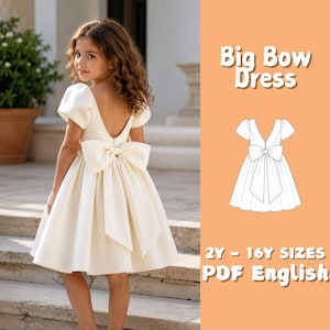 May include: A cream-colored dress with short puff sleeves, a deep V-back, and a large bow at the waist. The image includes text reading Big Bow Dress and 2Y - 16Y SIZES PDF English, alongside a black and white line drawing of the dress design.