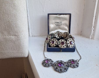 Rhinestone jewellery set: oxidised silver tone & purple brilliant cut rhinestone filigree floral pendant necklace and clip disc bracelet set