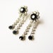 Shooting star earrings: Sparkly 1950s silver tone princess cut shooting star shaped rhinestone shoulder duster drop clip on earrings